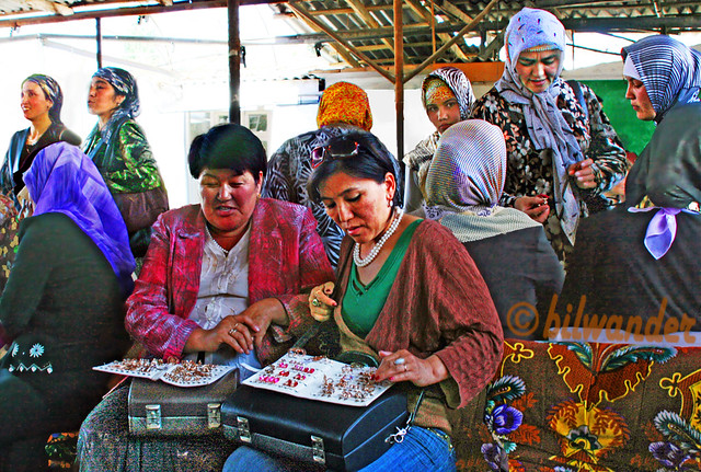 Kyrgyzstan, Osh bazaar, Kyrgyz women selling gold & jewelry