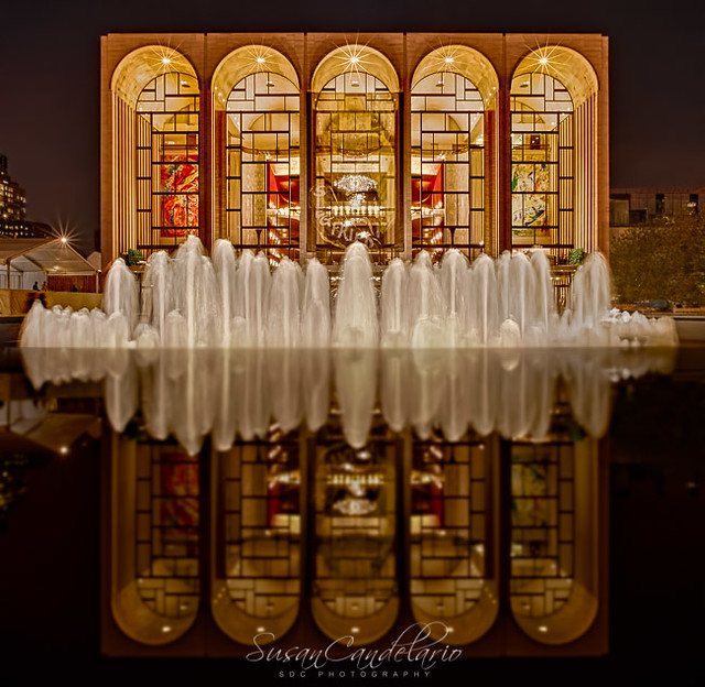 Opera House ReflectionsAn evening view of The Metropolitan Opera House, which is located in the center of the Lincoln Center Plaza in New York City. The Opera House and the Revson fountain is reflected off the black granite that forms a ring around the Fo