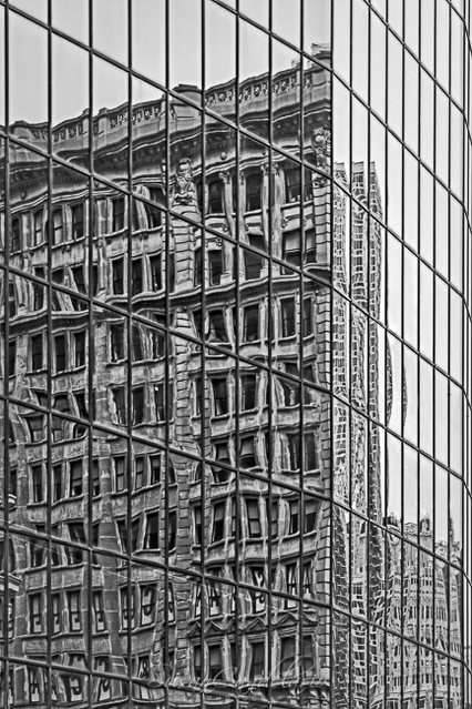 Architecture ReflectionsOld architecture style buildings are reflected on the windows of a modern architecture style building.Susan Candelariohttp://www.sdcphotography.com/http://www.sdcphotography.com/