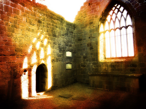 Light coming through the window of an Irish church ruin run through Pixlromatic