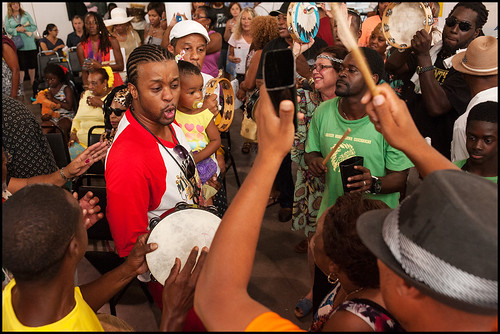 Bo Dollis Jr. with his daughter at the Mardi Gras Indian Hall of Fame event at Basin Street Station in New Orleans, summer 2015. Photo by Ryan Hodgson-Rigsbee - rhrPhoto.com