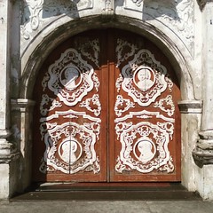 Main doors of the Sto Domingo Church in Abucay, Bataan. The doors are decorated with the symbolic representation of the Four Evangelists.