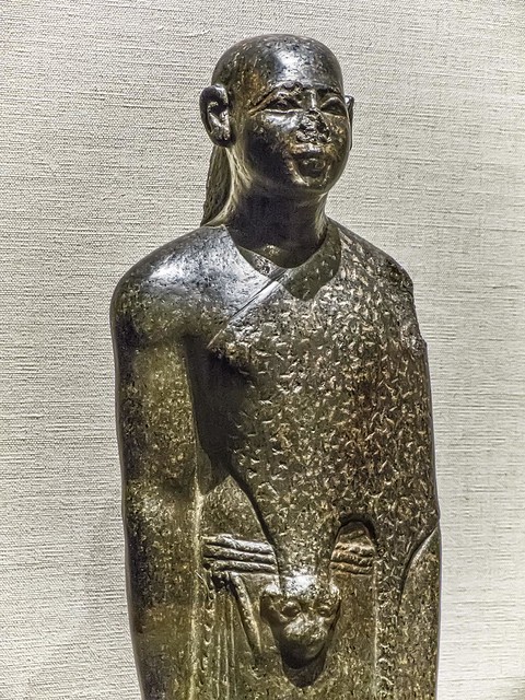 Closeup of Priest with Leopard or Cheetah Skin Mantle Egypt Late Period 26th Dynasty reign of Apries 589-570 BCE
