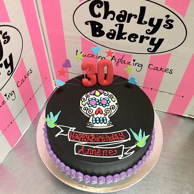 Tattoo & Candy Skull themed single tier 30th birthday cake iced in black chocolate ganache
