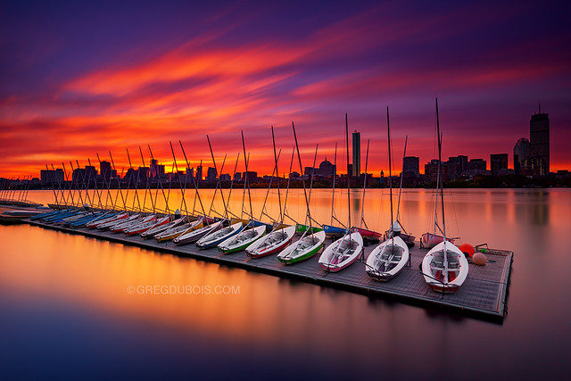 Sunrise over Boston Skyline and Charles River with MIT Sailing Pavilion Dock and Sailboats, Cambridge Massachusetts USA