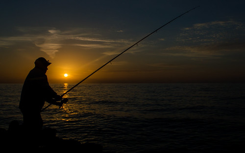 Fishing at The Sunset by MessaibiAnes, fishing fish sunset sun sea bait old man fished fisher sand rocks rock