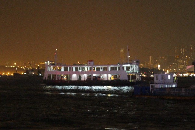 Vehicular ferry on Victoria Harbour by night