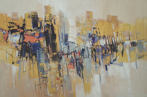 Thin city-like marks across a pale golden field