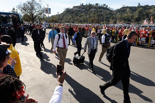 Members of the Wisconsin football team arrive at the stadium.