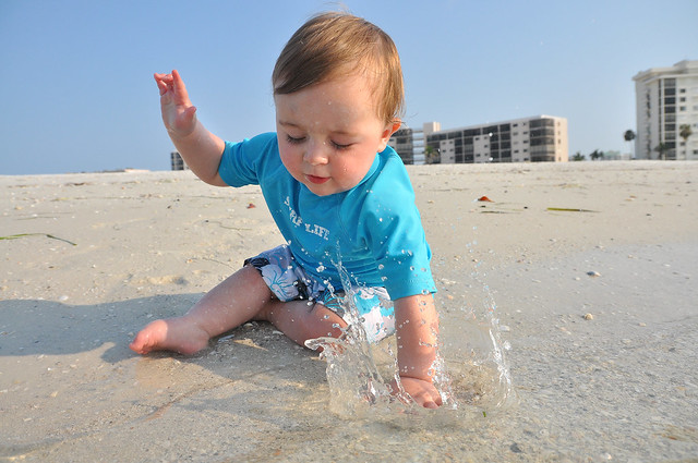 Baby splashing at the beach