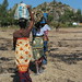 Village ladies carry goods