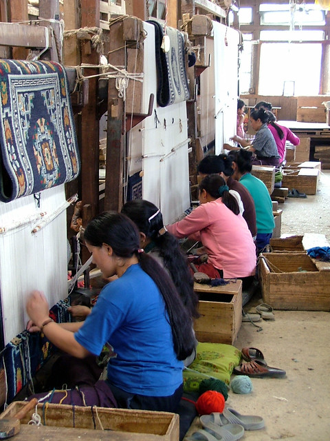 Carpet weavers in Darjeeling, India - Tibetan refugee workshop. in 2005. Sandra Dillon, photographer. Flickr Photo by Knoxville Museum of Art, 2005