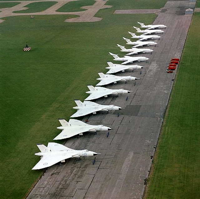 Six Avro Vulcan B.2 aircraft of No 617 squadron and six Handley Page Victor B.2 aircraft of either No 100 or No 139 Squadron (from RAF Witttering) lined up at RAF Scampton.
