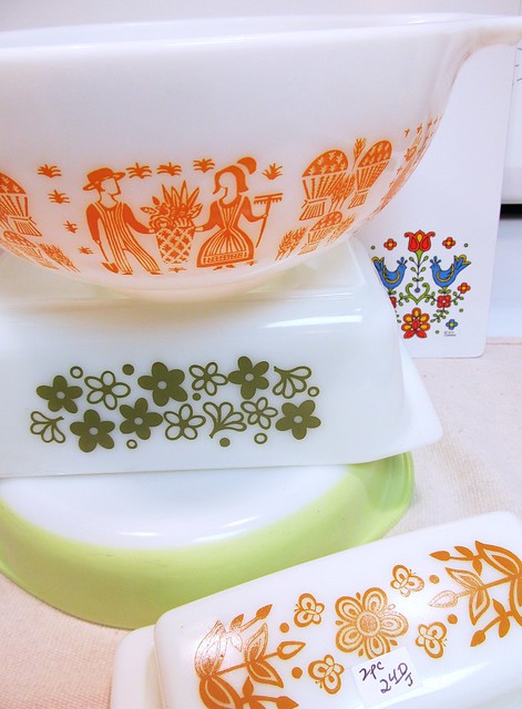 Orange Butterprint, Spring Blossom loaf pan, lime green cake pan, Butterfly Gold butter dish and a Corning counter saver in the very back.
