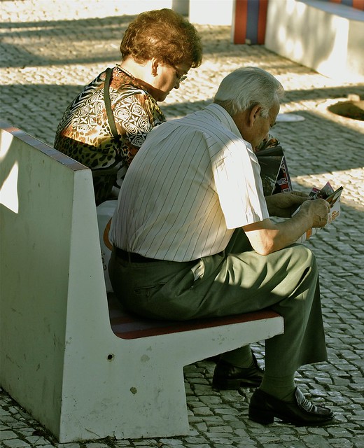Elderly couple reading