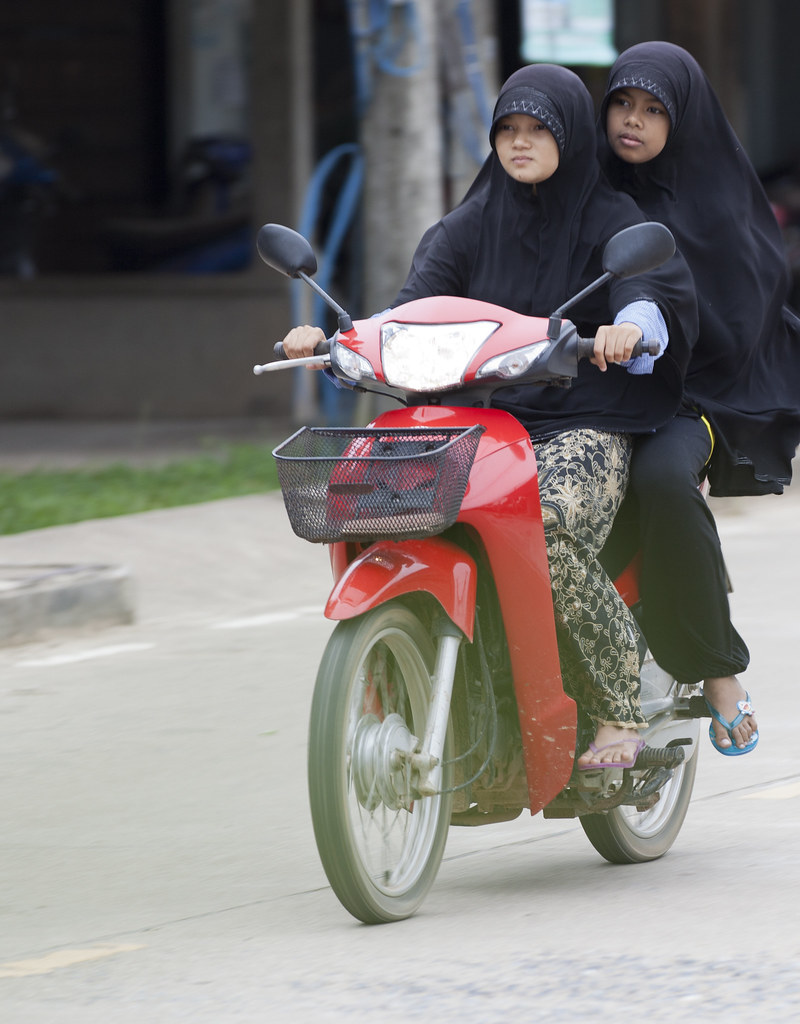 Muslim girls on bike