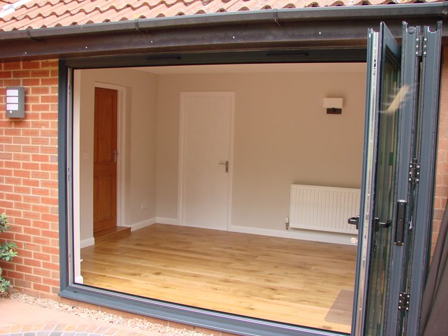 <p>Created sun room out of half of double garage with bi-fold door.</p>