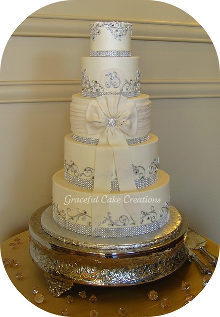 Elegant Ivory Buttercream Wedding Cake with Bling Ribbon, Jewels and Bow