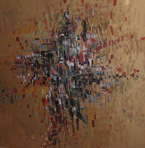 Dense fine dark marks on a warm brown background