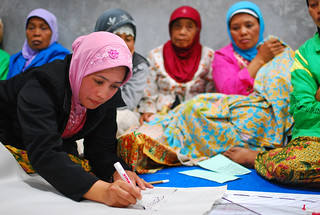 Women at a community meeting discuss the reconstruction of\u2026 | Flickr