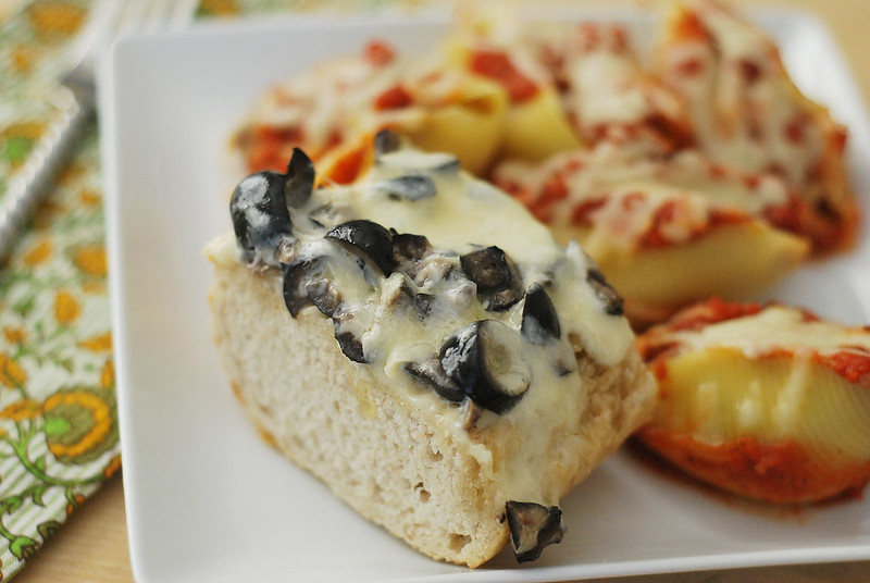 Olive Cheese Bread - French bread topped with a creamy, cheesy olive mixture and baked until the cheese melts and starts to brown. The perfect side dish for pasta night!