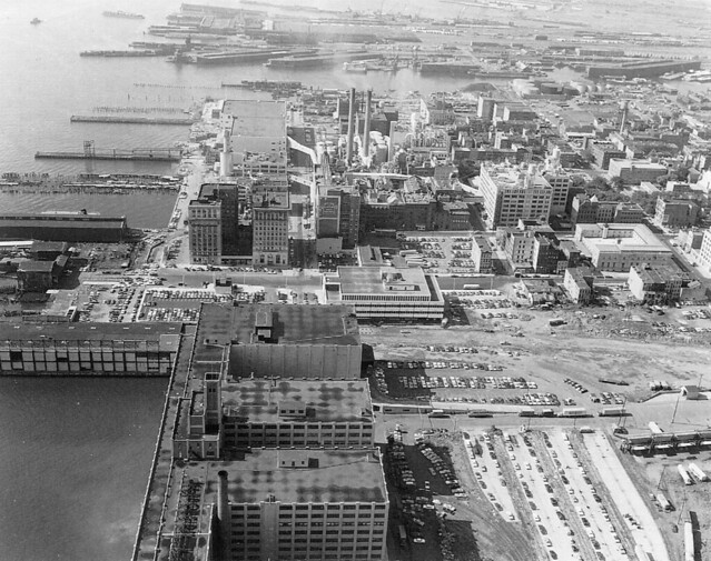 Harborside Terminal at bottom, Exchange Place with abandoned piers and the Colgate Plant at center, Morris Canal and Central RR of New Jersey at top. The Pennsylvania RR tracks had recently been pulled up in the lower part of the view. Jersey City. 1970