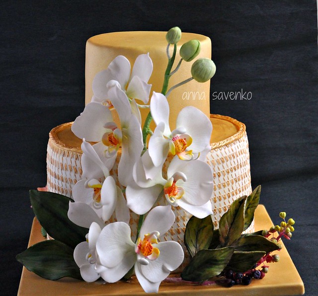 Golden cake with orchids