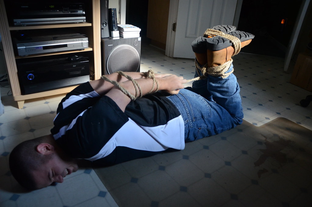 Boyfriend Hogtied in Jeans and Ariat Cowboy/Work Boots. 