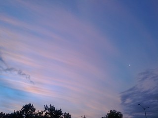 Melbourne sunset with mares tails, contrail and moon