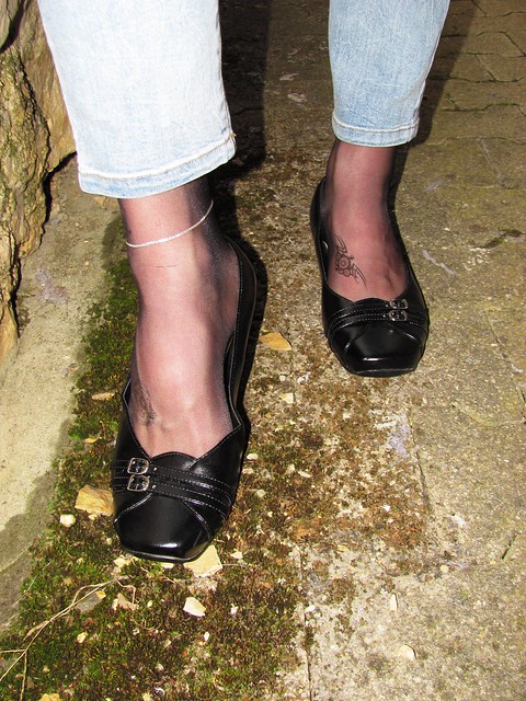 cute black leather flats, nylons, tattoos, anklet and jeans, outdoor shots