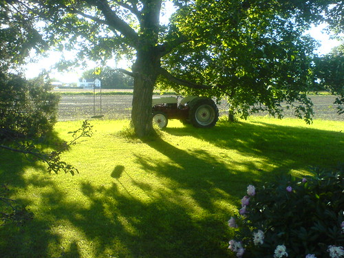 Tractor in the Sun by phlphll, This is one of the best photos I was able to squeeze out of my old Sony Ericsson phone. It was take