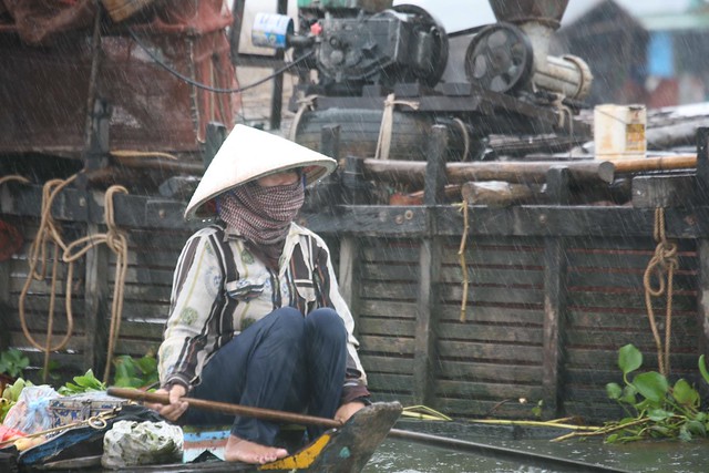 Produce Seller Monsoonal Downpour Tonle Sap Lake Cambodia No Matter the Weather