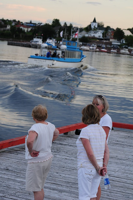 Betty Matthews, Sandra Vardy, and Margaret Hawkins on the Island Wharf with Tour Boat
