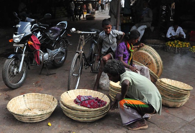 Family working at a market in Mumbai