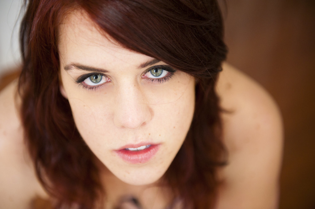 Topless Sexy Redhead with Green Eyes.