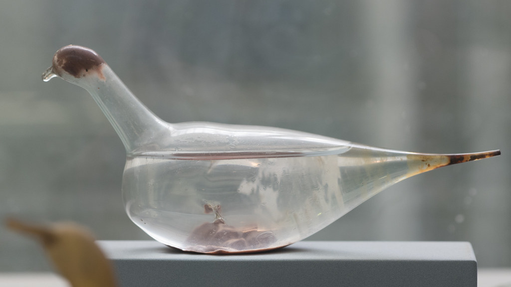 Roman glass unguentarium in the form of a dove, containing the remains of a balsam (1)