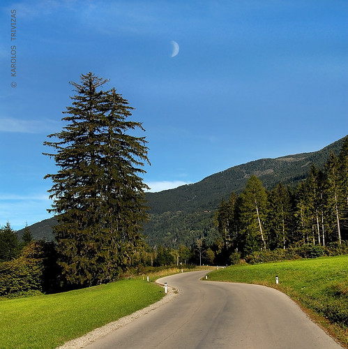 austria carinthia spittalanderdrau oberdrauburg road coniferous hill mountain moon firtrees lawn grass fields slope countryside idyllic driving