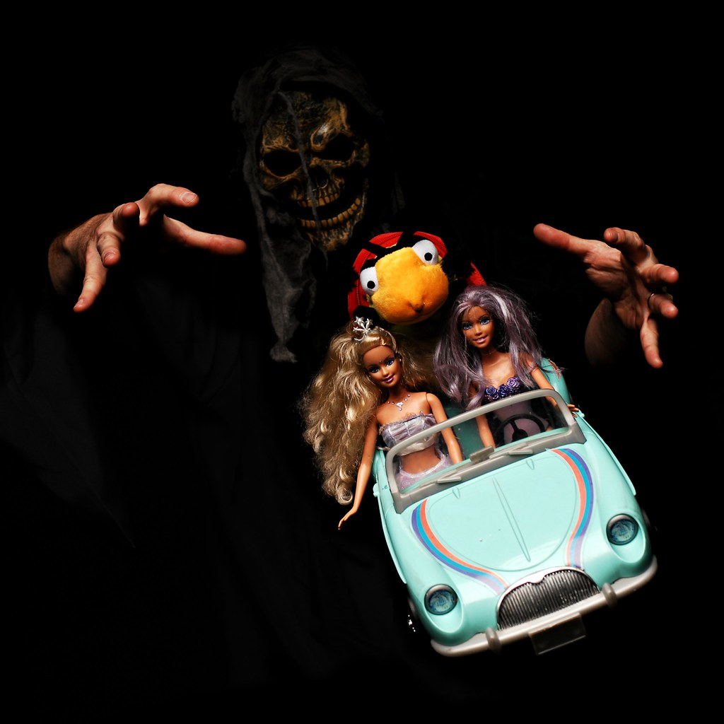 At the Insistence of the Tweedlebug, the Pseudo-Barbies Negotiate Dead Man's Curve for the Last Time by Studio d'Xavier