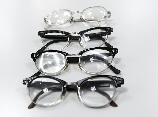 Evidence of life: 1950's eye glasses, 4 pair, thick lens, donations, Lenscrafters, Northgate, Seattle, Washington, USA