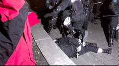 Portland Police-flying knee drop on a cuffed citizen on concrete