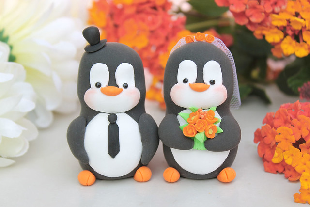 Penguin wedding cake toppers - orange