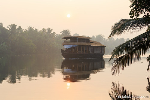 Floating Colonialism by Jakob Kolar, Typical Kerala Houseboat floating through the Backwaters at Sunrise, Kerala, India 2016

Photo: © Ja