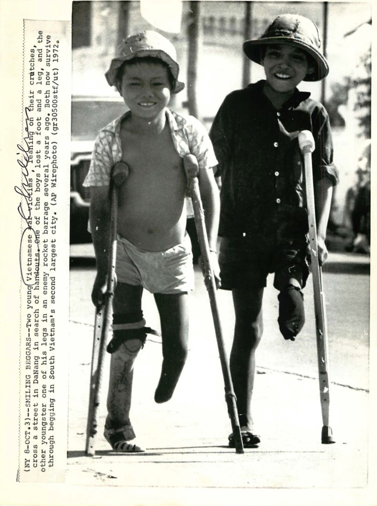 1972 Smiling Vietnamese Boy Beggars on Crutches in Da Nang - Press Photo