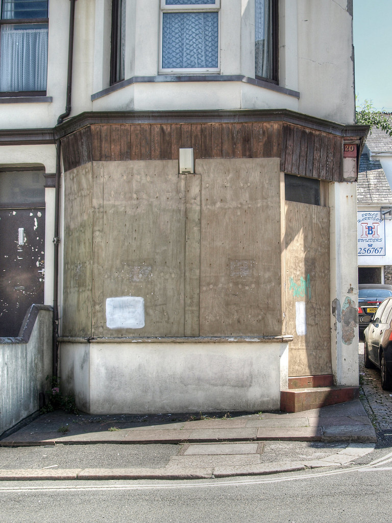 boarded-up shop
