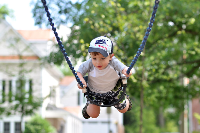 Toddler Mason swinging