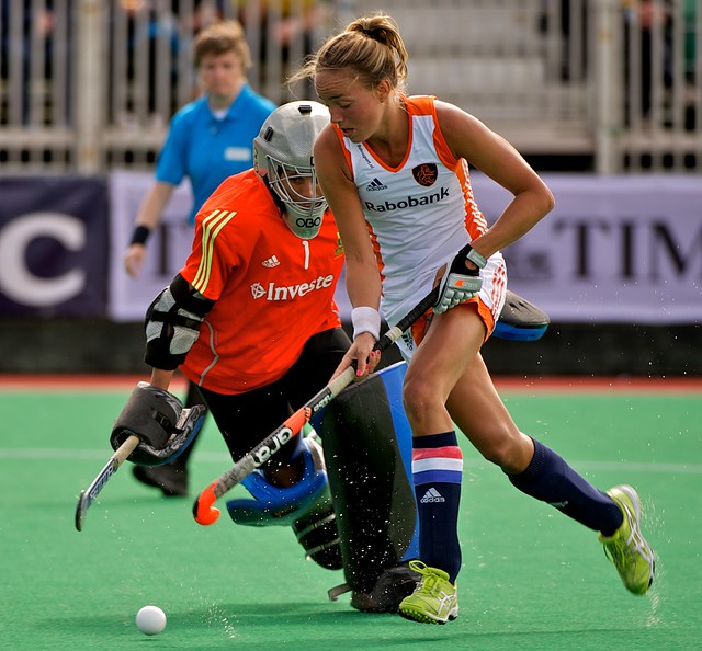 Dutch Captain Maartje Paumen rounds Rix to score in the shoot out