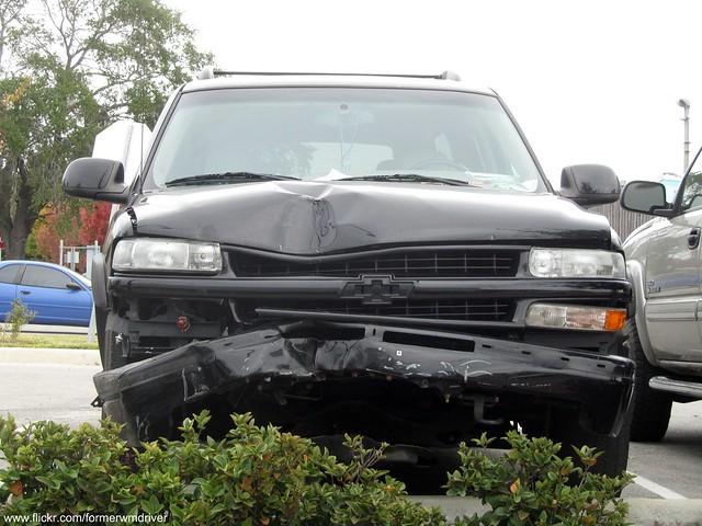 Wrecked Chevrolet Suburban in a random parking area