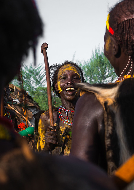 Dassanech tribe teenage girl dancing during dimi ceremony to celebrate circumcision of teenagers, Omo valley, Omorate, Ethiopia