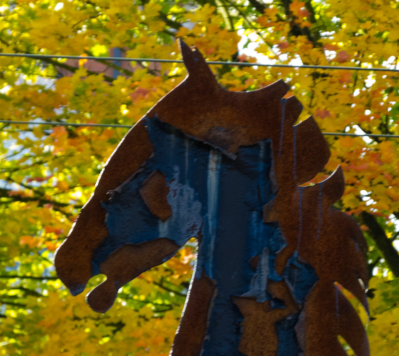 Autumn leaves with head of horse sculpture