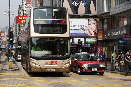 Taxi and a double deck buses on Nathan Road